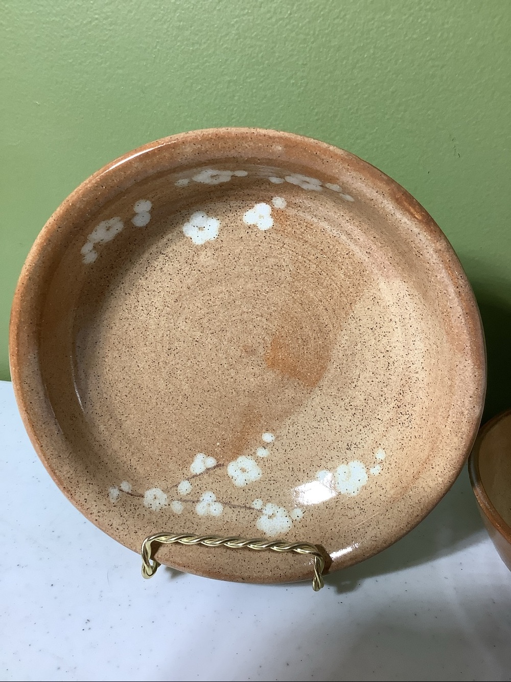 Tan with white flowers shallow stoneware bowl